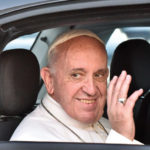 Pope Francis waves as he departs.